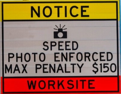 a speeding penalty warning sign